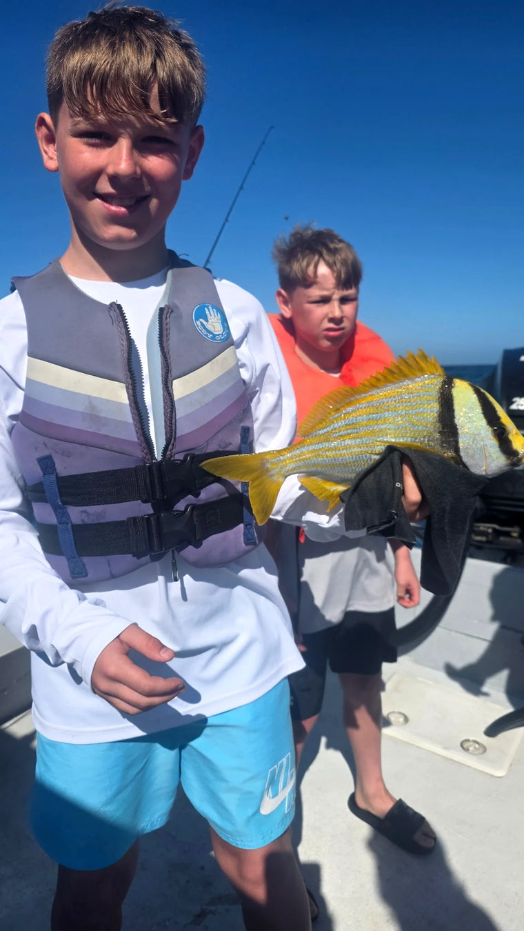 Guest with a fish on a Sarasota fishing charter
