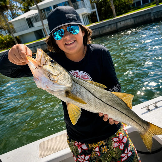 Sarasota fishing charter guest with catch