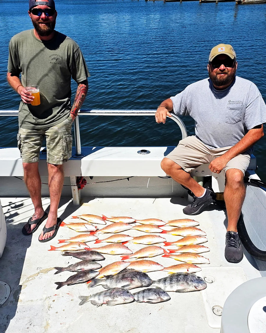 Group of anglers with a full catch on an offshore fishing charter