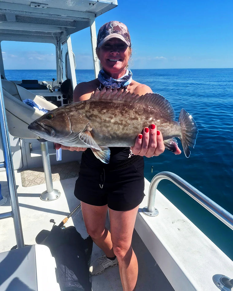 Guest with a fish on a Sarasota fishing charter